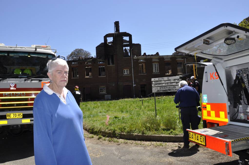 "GUTTED:" Former Kenmore Hospital museum volunteer Leone Morgan says more of the site's history will be lost forever unless the state government acts on the buildings' degradation. On Saturday, fire destroyed a former female ward. Photo: Louise Thrower.