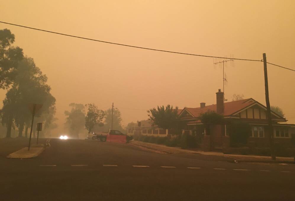 Bradley Street at 5pm Saturday, December 21, was smothered in smoke. Photo: Peter Fraser.