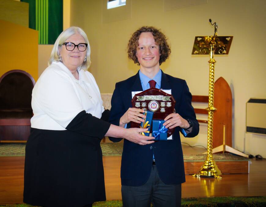 Tom Skeffington scored an ATAR of 93.55 in the HSC. He's pictured here with principal Gaye McManus receiving his Proxima award at the annual presentation. Picture supplied. 