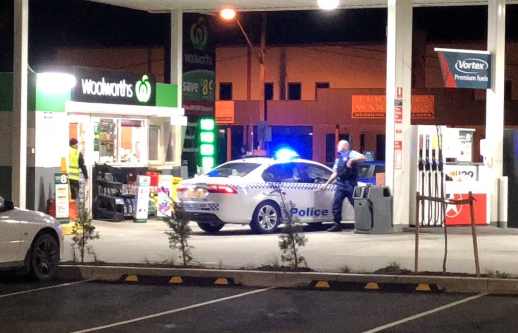 Police investigated at Caltex Woolworths in Clinton Street on Friday night following an alleged car-jacking. Photo: Tom Sebo.  