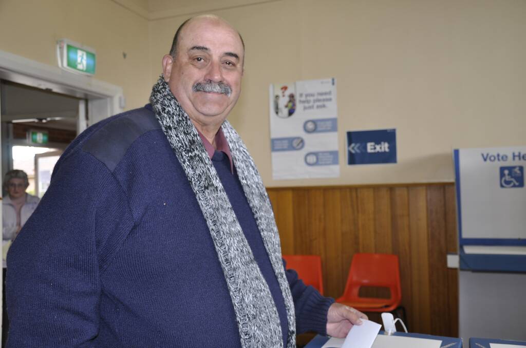 Current mayor Peter Walker casting his vote at the 2016 Goulburn Mulwaree Council election. He was elected that year, subsequently served as deputy mayor and won the mayor's job in January, 2022. Photo: Louise Thrower.