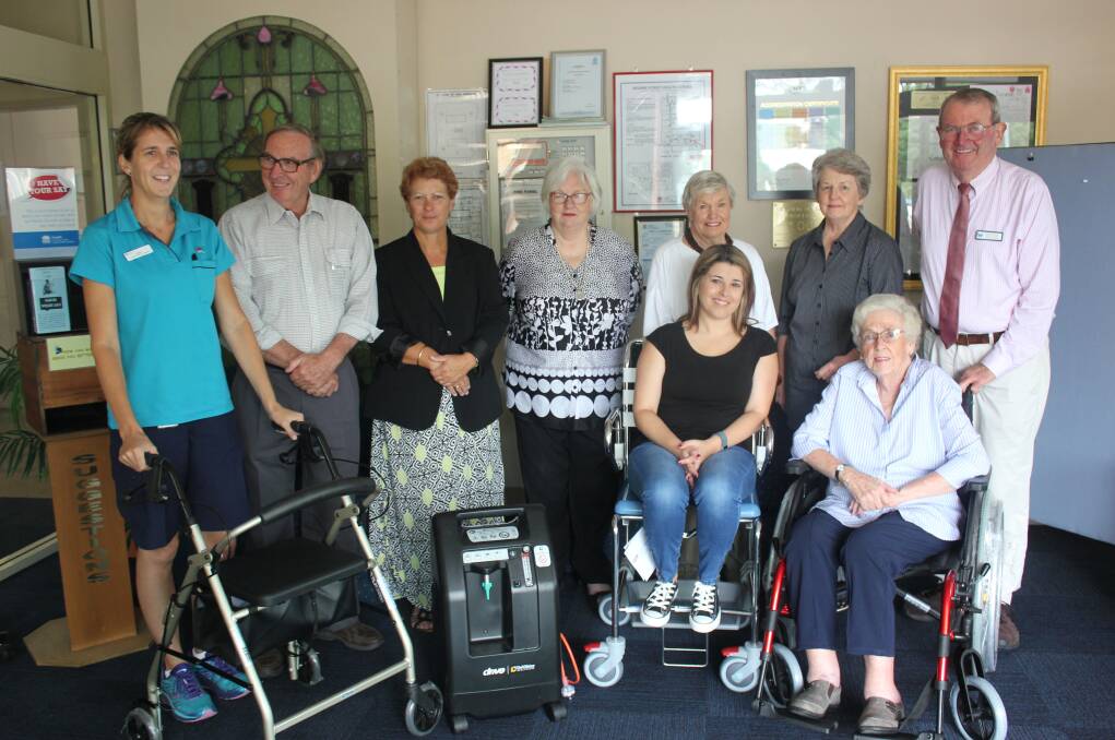 Goulburn Palliative Care and Oncology Support committee members, including Sue Hannan (right) with Bourke Street Health Service staff in 2017. The group had donated $3000 worth of equipment to the facility.