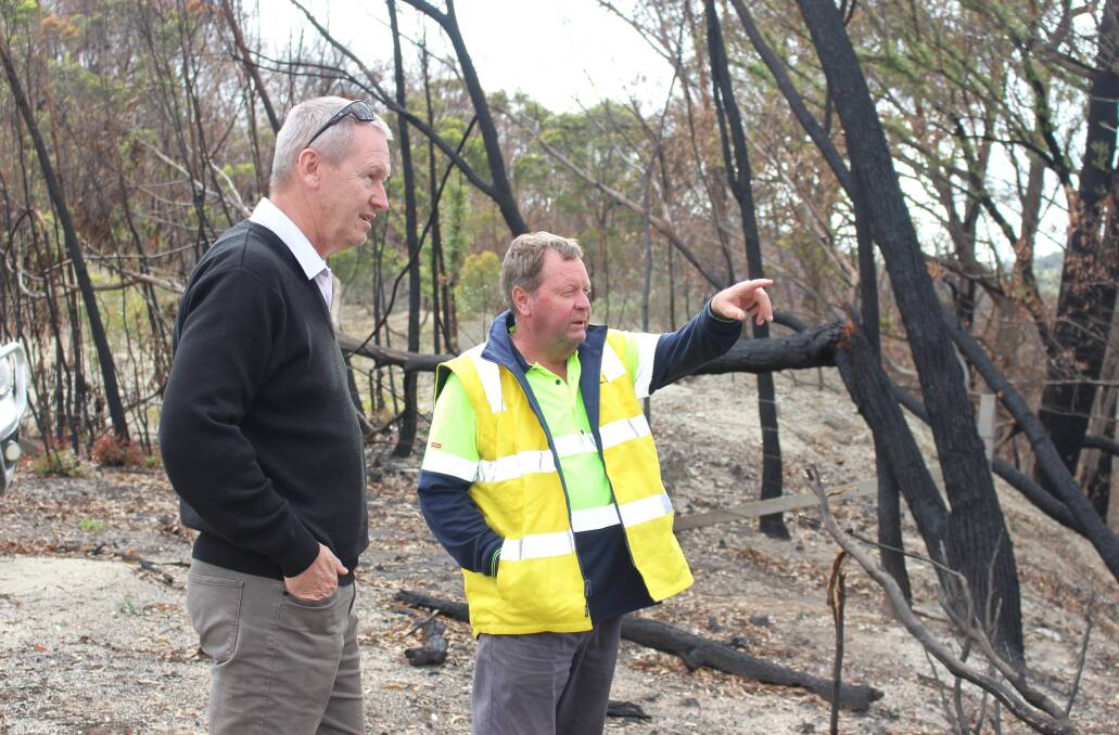 DAMAGE: Upper Lachlan Shire Council manager of infrastructure delivery Scott Parsons recently looked over work on Wombeyan Caves Road with maintenance co-ordinator (Crookwell) Eric Croker. Photo: Supplied. 