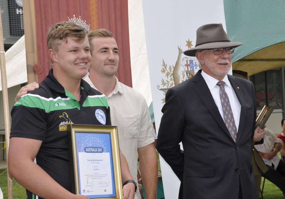 Manly Sea Eagles player and Upper Lachlan Shire sportsperson of the year Lachlan Croker (centre) presented Jack Page with the Shire's junior sportsperson of the year certificate, watched by Governor General David Hurley. Photo: Louise Thrower.