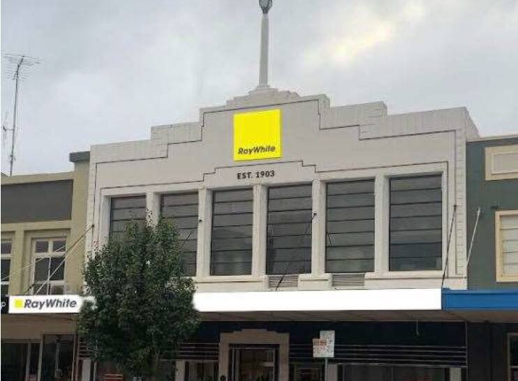 Ray White Real Estate is proposing to replace the Goulburn Evening Penny Post and Est 1870 sign on the facade of 199 Auburn Street with this signage. Image sourced. 