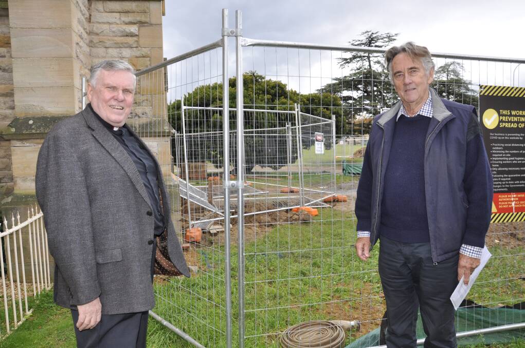 Deam Phillip Saunders and heritage architect Michael Fox show the excavations underway on the Cathedral's eastern aspect. Photo: Louise Thrower.
