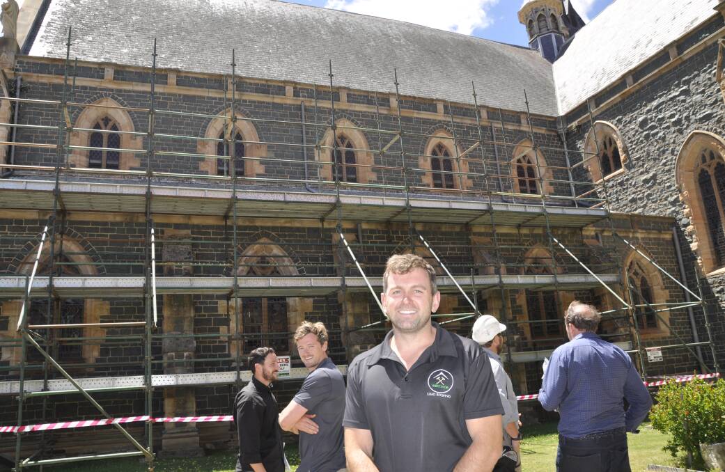 Kyle Glasby of Heritage Slate Roofing is part of the team repairing the cathedral's slate roof which are "at the end of their life span" and slipping from corroded nails. Photo: Louise Thrower.