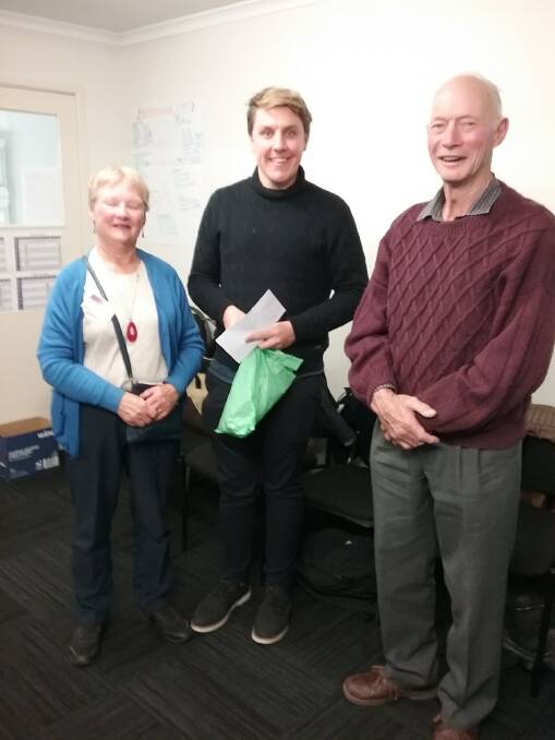 BOOST: NSW Farmers' Goulburn branch chair Margaret Cameron and committee member Noel Lawton recently presented third year medical student Joseph Beaton with a scholarship. Photo supplied.