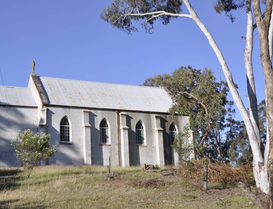 PRIZED: The Bungonia community is making a concerted effort to conserve the Saint Michael's Catholic Church. Immediate attention has turned to replacing weather-affected windows. Photo: Louise Thrower. 