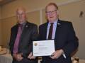 Rotary Club of Goulburn outgoing president Geoff Thrower presented Bob Kirk with a Paul Harris Fellowship at Monday's annual changeover dinner. Photos: Louise Thrower. 