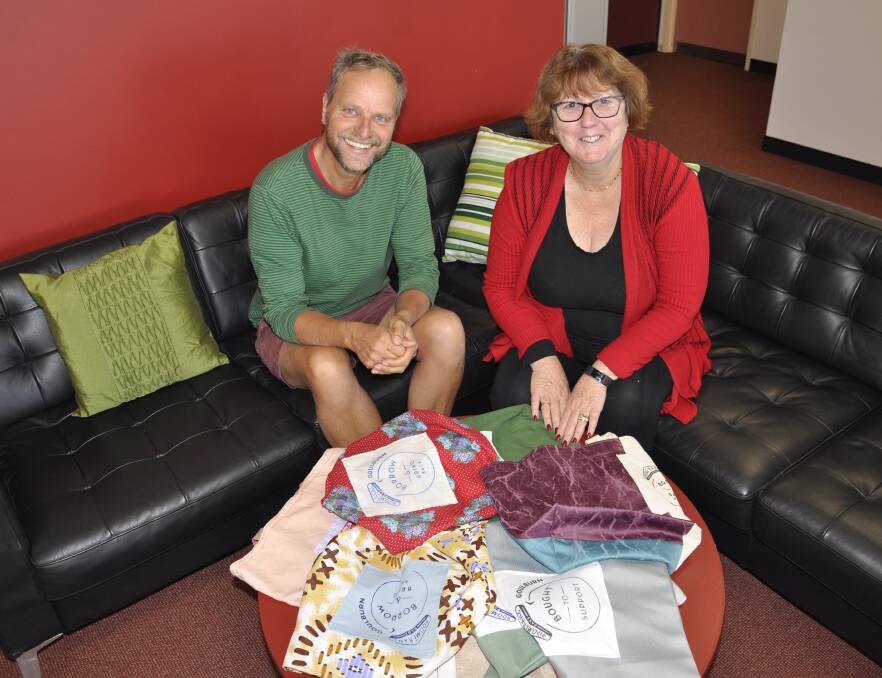 IN THE BAG: Workspace 2580 computer trainer and tutor Stephen Allen and project manager Julie Kelly show off the wide array of Boomerang Bags. Photo: Louise Thrower.