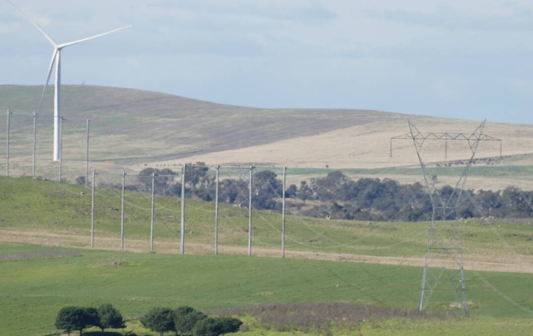 Upper Lachlan already has enough wind turbines, says Upper Lachlan Shire mayor, Pam Kensit. Here, the Gullen Range wind farm sits amid an existing 330 kilovolt transmission line. Photo supplied.