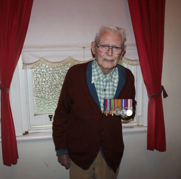 Rodger Penman displaying his Air Force war medals last year. Photo: Burney Wong.