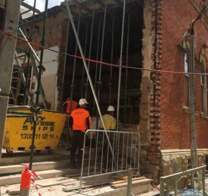 Workers peer into the old section of the McDermott Centre. The building was constructed in 1887 to an EC Manfred design. Photo: Goulburn Mulwaree Council.