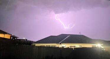 WHAT A SHOW!: The storm created a spectacular lightning show over Goulburn and district. A resident snapped this strike from McGrath Place, Goulburn. Photo: 'Nabin DC.'