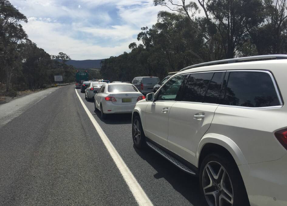Southbound traffic was lined up on the Hume Highway earlier last month to turn right into Carrick Road, following a crash that closed lanes. The council is applying for funds to upgrade Carrick Road, which it said had deteriorated as a result of the diversions. Photo: Louise Thrower.
