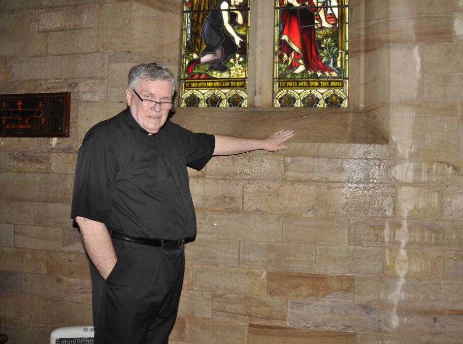 Dean of Saint Saviour's The Very Reverend Phillip Saunders shows where rain came flooding down the Cathedral's Mesac Thomas Chapel. Photo: Louise Thrower.