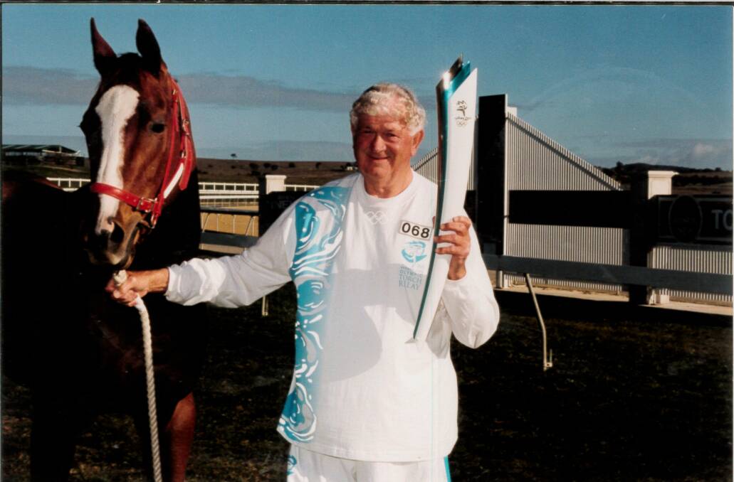 Fred Cooper carried the 2000 Olympic torch for NSW Country Racing on its journey through Goulburn. Photo supplied.