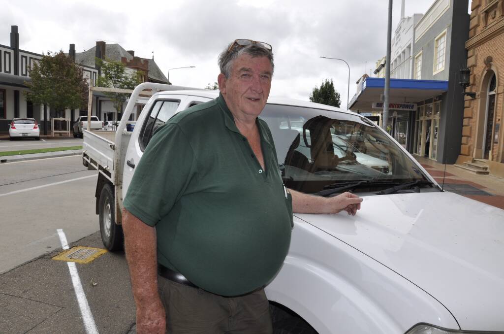'WRONG PLACE': Goulburn man Mick Butz is urging the council not to plant more Manchurian trees in the CBD. He claimed fruit from the tree behind had left permanent marks in his car's panels after corellas attacked the fruit. Photo: Louise Thrower.
