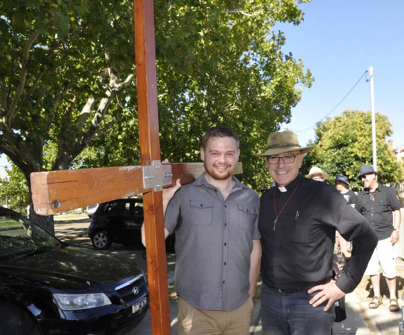 Bishop Stuart Robinson carried out one of his last duties at Easter with the Walk with the Cross. He is pictured here with parishioner Michael Shaw. A new Anglican Bishop for Canberra/Goulburn will be known early next week. 