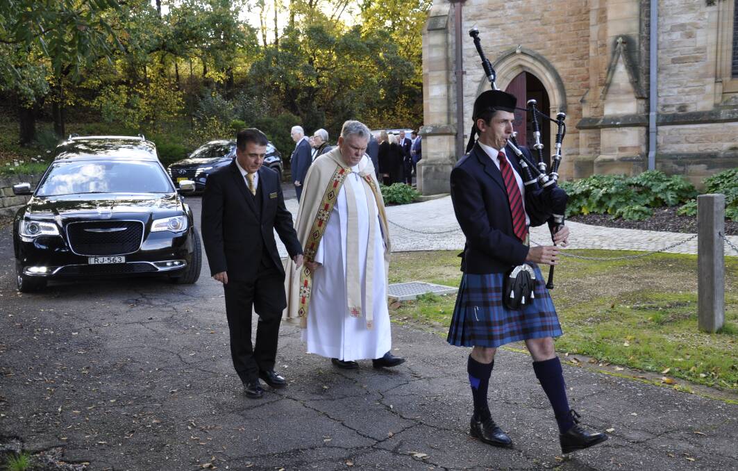 Piper Joe Chalker led the hearse from the Cathedral, accompanied by Dean of Saint Saviour's, The Very Reverend Phillip Saunders, and RJ Sidney Craig funeral director, John Crooks. Photo: Louise Thrower.