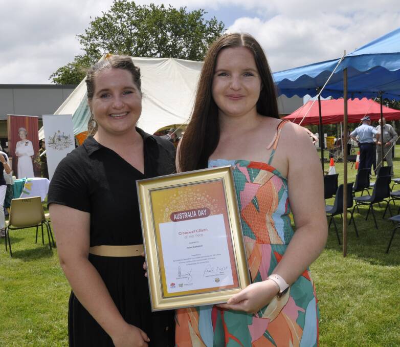 Twins Emily and Kathleen Campbell were justly proud of their grandmother, Helen Campbell, for her Crookwell citizen of the year award. Mrs Campbell was unable to attend the ceremony. Photo: Louise Thrower. 