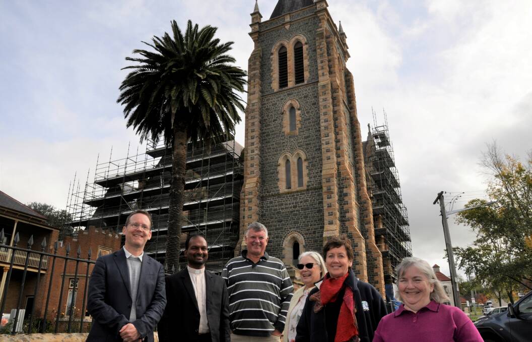 Labor candidate Greg Baines (left) and Hume Electoral Council treasurer Dr Ursula Stephens (second right) announced the Sts Peter and Paul's Cathedral funding earlier this month. Photo: Louise Thrower.