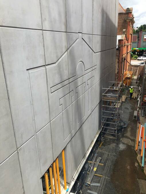 HERITAGE: The shape of the building demolished at the rear of the McDermott Centre has been engraved on the pre-cast panels. Photo supplied.