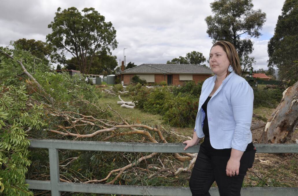 'LOCKED OUT:' Natalie Gordon watched as trees were removed from her late grandparents' Rex Street property on Monday to make way for eight multi-units. She says the community must be given greater say in the complying development process. Photo: Louise Thrower.