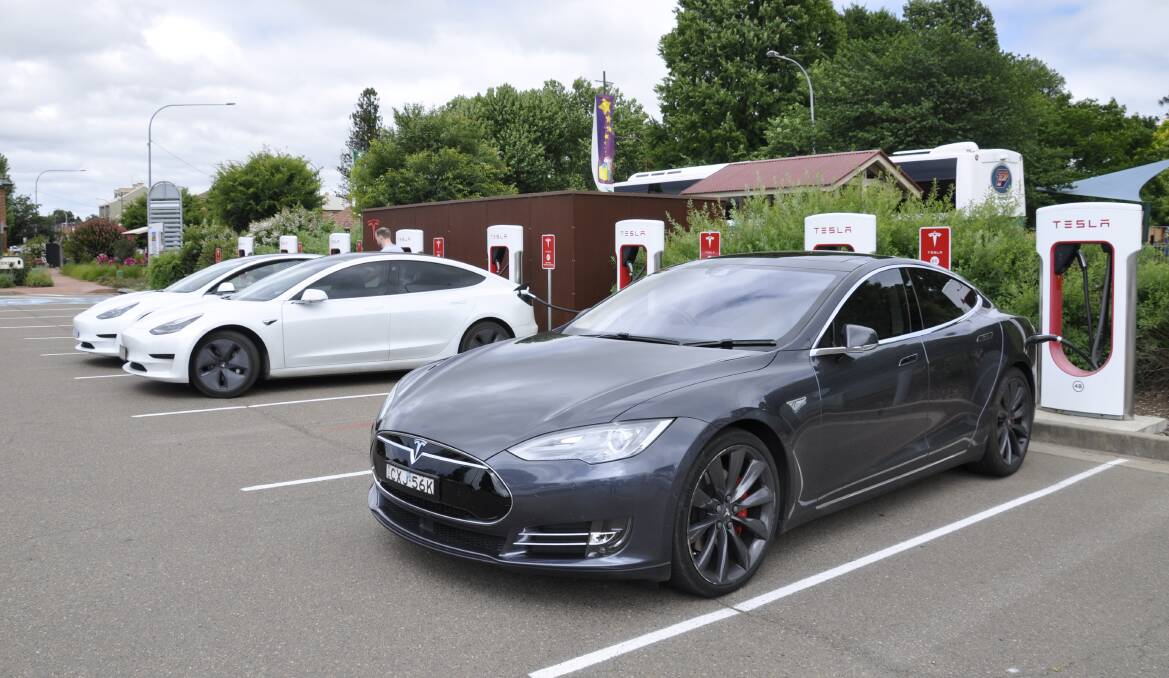 Several vehicles were taking advantage of the Tesla charging stations at the Visitors Information Centre on Wednesday. Photo: Louise Thrower.