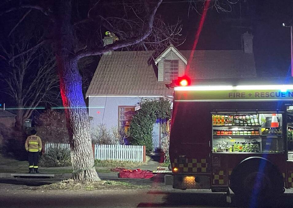 HEADY HEIGHTS: Goulburn's NSW Fire and Rescue retained firefighters pulled out all the stops in an attempt to free a trapped possum at a home on Saturday night. Photo: Ben Lynch.