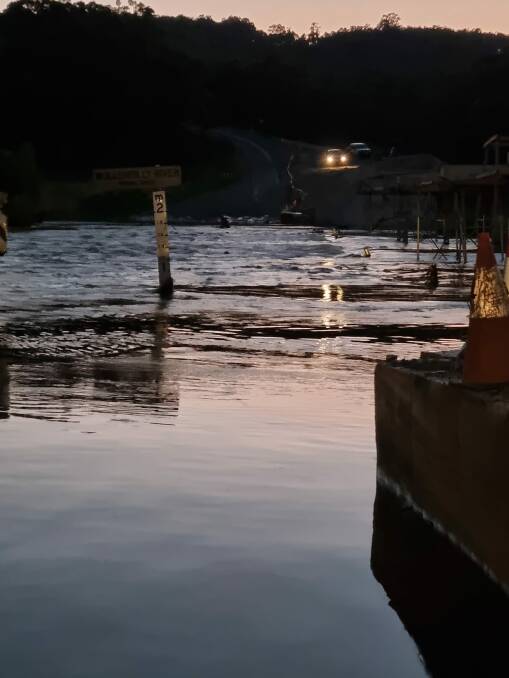 Flood water was 70cm over Towrang Bridge on Saturday night. Photo: Towrang Bridge Flood Update and Local News Facebook site.