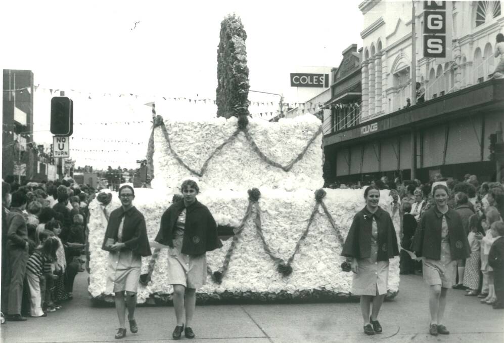Goulburn Base Hospital's float in the 1976 Lilac City Festival. Walking in front are Shirlene Hall, Nicki Hanson, Wendy Hill and unknown. Picture by Goulburn Post.