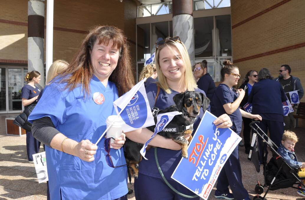 Enrolled nurse, Michelle Cook, and registered nurse, Sarah Pike, joined in the Goulburn action. Ms Pike later spoke at the rally in Belmore Park. Photo: Louise Thrower.