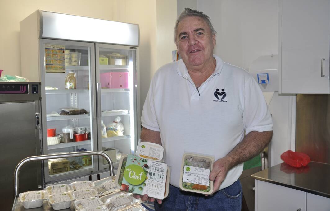 Goulburn Meals on Wheels president Michael Parsons displays just some of the new range of meals being delivered in the community. Photo: Louise Thrower.