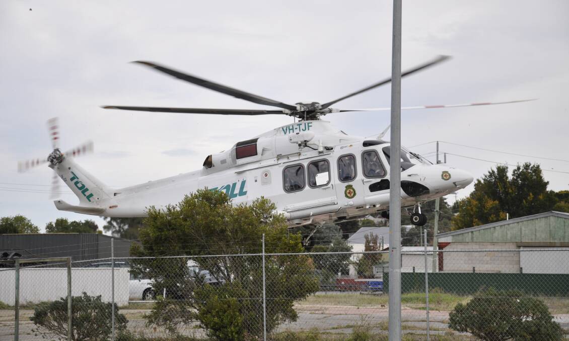 The Toll helicopter airlifted a Goulburn man from the accident scene to Canberra Hospital. Photo: Louise Thrower. 