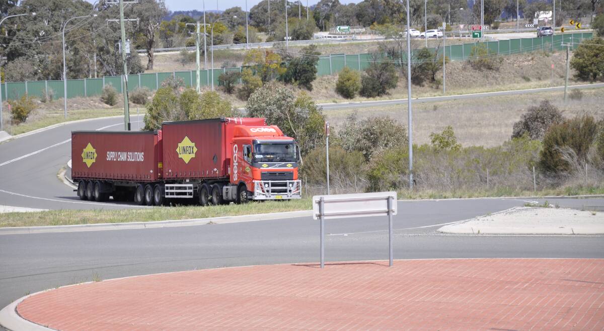 A Linfox truck emerges from the Coles Distribution Centre at Goulburn. Local truck drivers contracted to Coles will also be affected by the centre's closure. Photo: Louise Thrower. 