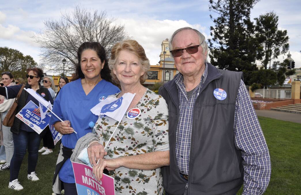 Nurses Jenelle Crooks and Carmen Fischer were among those taking part in the strike. Don Fischer (right) also spoke at the gathering, saying "the government had its priorities wrong." Photo: Louise Thrower. 