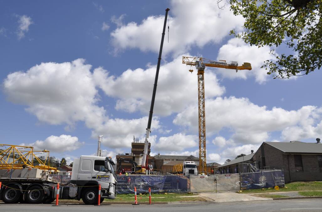 GOING UP: The tower crane was taking shape on the Goulburn Base Hospiotal site on Tuesday morning. It will facilitate construction of the four-storey clinical services building. Photo: Louise Thrower.