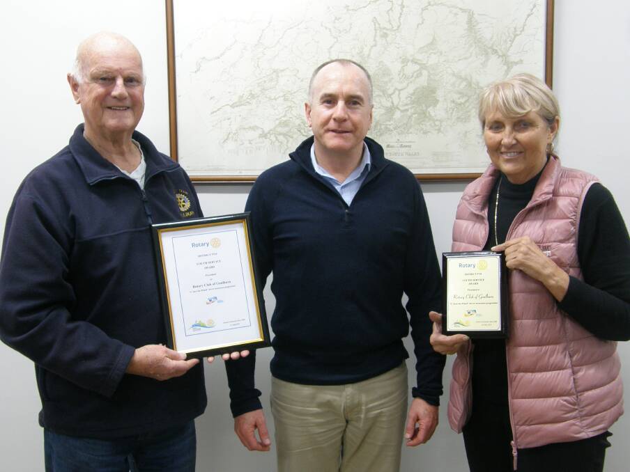 GREAT WORK: Rotary Club of Goulburn member Ian Radford displays the award with president Justin Kell and Rotarian Carol James.