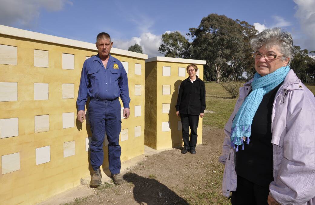JOINT EFFORT: Bungonia Historical Society members Anne Wiggan (front) and Diana Moran with stonemason, John Mottley, are proud of the village's latest project.