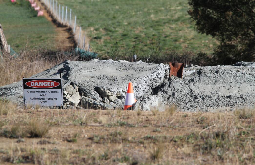 Tarago Progress Association president Adrian Ellson claims a sand and concrete cell covering lead contaminated soil near the rail corridor has broken up, posing a risk to the community. Transport for NSW says the cell is in 'good condition.' Picture by Adrian Ellson. 