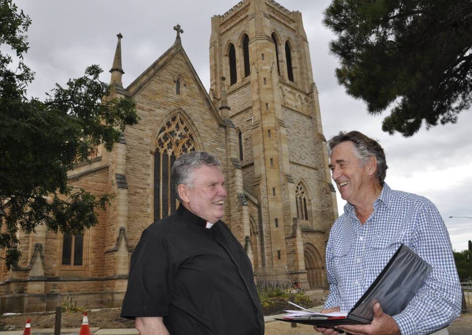 HISTORY TALKS: Dean of St Saviour's Cathedral The Very Reverend Phillip Saunders chats over conservation plans with architect, Michael Fox. Photo: Louise Thrower.