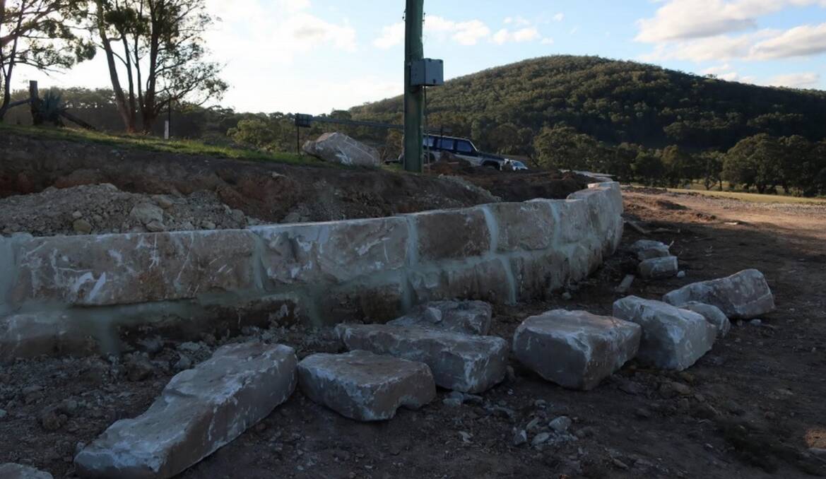 LANDSCAPING: In May, council planners said they found a large sandstone retaining wall under construction, despite the stop-work order issued in April. Photo: Supplied.