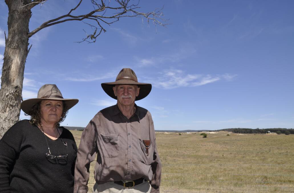 Diane and Phil Broadhead say the State government is not acting on their water concerns. Multiquip's Ardmore Park quarry is pictured in the background, off Oallen Ford Road. 