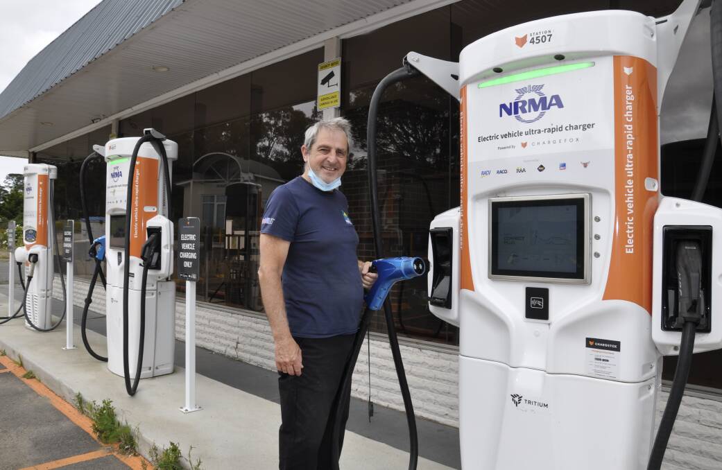 EXTRA SERVICE: Manager of Budget Petrol Goulburn, Stefan Petalotis, demonstrates one of the electric vehicle super-chargers at the Sydney Road service station. Photo: Louise Thrower. 