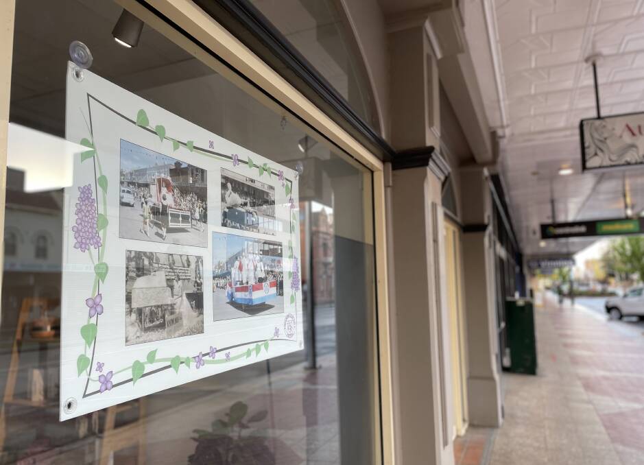 Photos of past festivals adorn Auburn Street shop windows. Photo: Louise Thrower.