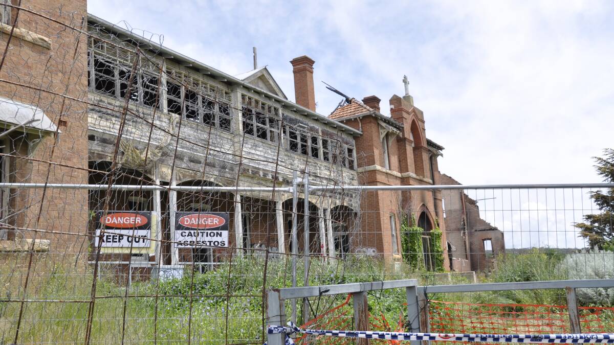 ACTION: The owner of the former St John's orphanage has erected fencing and signage warning of asbestos in response to an emergency order issued by Goulburn Mulwaree Council.