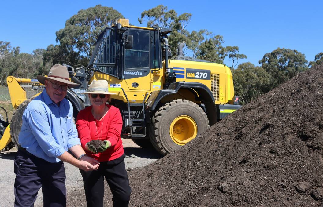 RE-USE: Mayor Bob Kirk and Goulburn MP Wendy Tuckerman at the launch of the city's compost pad in March. The material is recycled organic waste. Photo supplied.