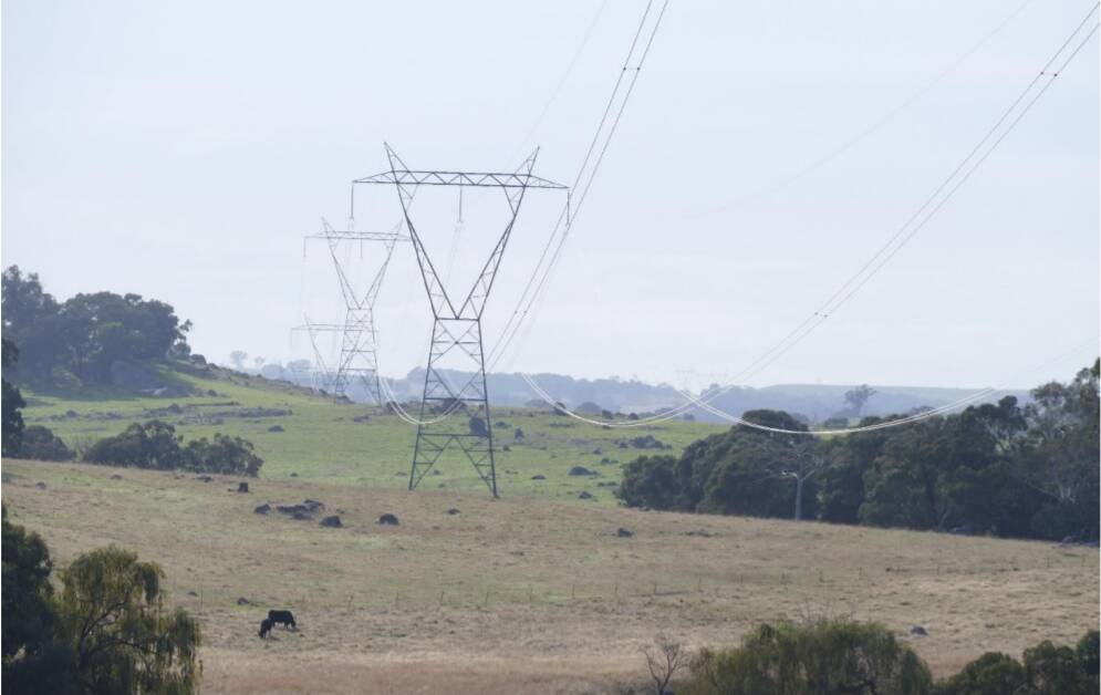 VISUAL IMPACT: A 330 kilovolt transmission line already traverses the Upper Lachlan Shire. Residents want Transgrid to place its 500 kilovolt HumeLink transmission line underground. Photo: Andrea Strong.
